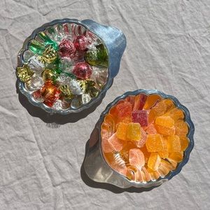A pair of metal shell dishes